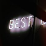 Image, neon lights spelling the word "best"